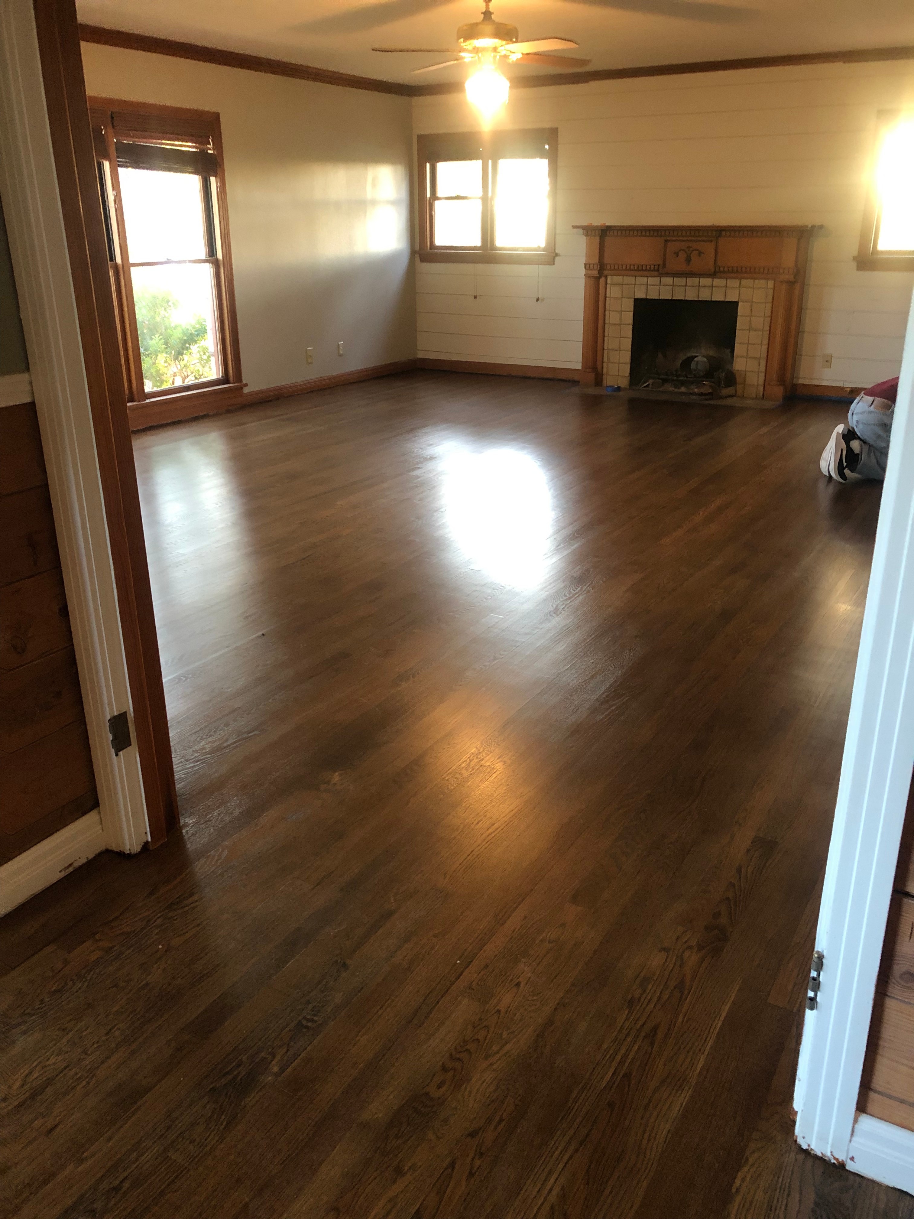Beautifully refinished hardwood floor by R.G. Pro Floors in Brownwood TX — dark walnut stain with glossy finish